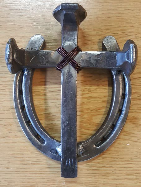 Welded spike horseshoe cross